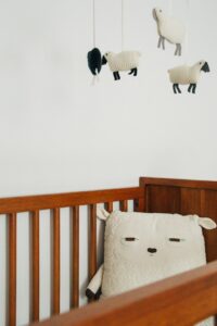 You can't tell it from this picture of soft sheep on a mobile above a crib, but nursery rhymes meanings are often disturbing.